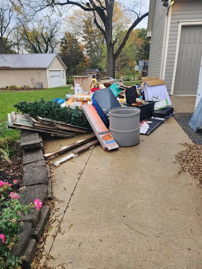 Dumpster being loaded with debris for Commercial Dumpster Rental in Arizona City